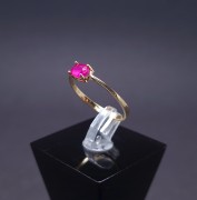 Gold ring with colored stone