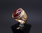 Gold ring with colored stone