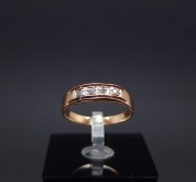 Gold ring with zircons