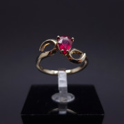 Gold ring with a garnet