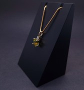 Gold pendant with diamond end colored stone