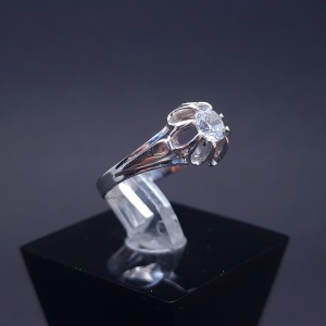 White gold ring with zircons
