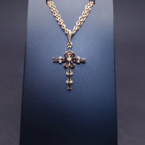 Gold cross with colored stones