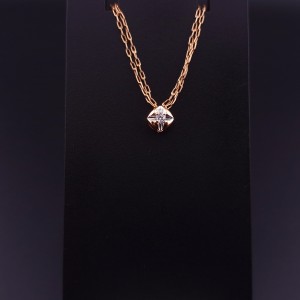 Gold pendant with zircon