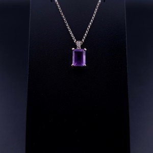 Gold pendant with colored stones