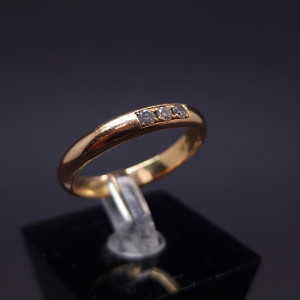 Gold wedding ring with diamonds