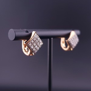 Gold earrings with zircons 