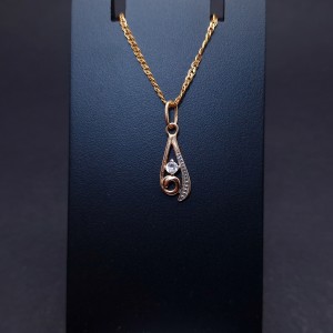 Gold pendant with zircon