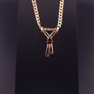 Gold pendant with colored stones