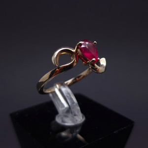 Gold ring with a garnet