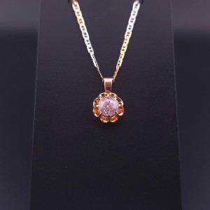 Vintage gold pendant with colored stone