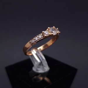 Gold ring with zircons