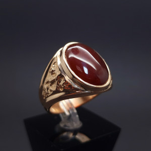 Gold ring with colored stone