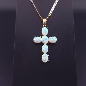 Gold cross with opals