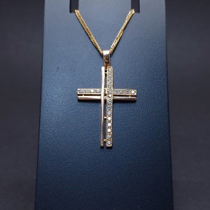 Gold cross with zircons