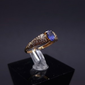 Gold ring with topaz and zircons