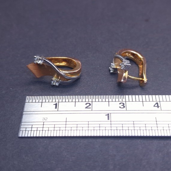 Gold earrings with zircons 