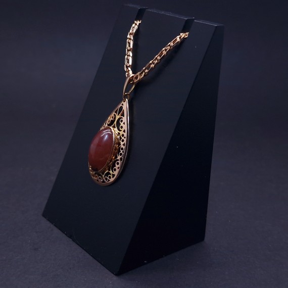 Vintage gold pendant with colored stone