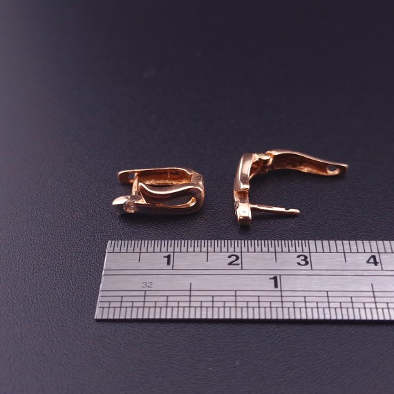 Gold earrings with zircons 