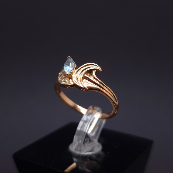 Gold ring with diamonds and colored stone