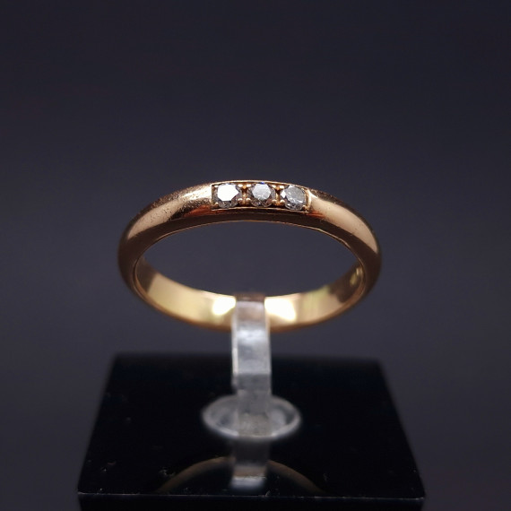 Gold wedding ring with diamonds