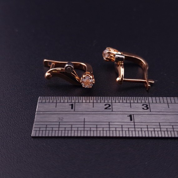Gold earrings with zircons 