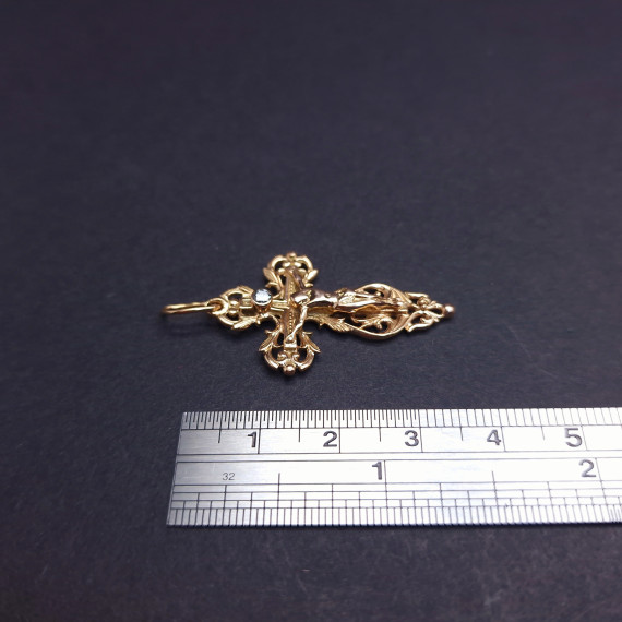 Gold cross with diamond