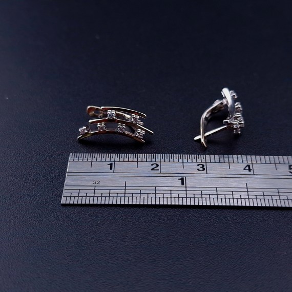 Gold earrings with zircons 
