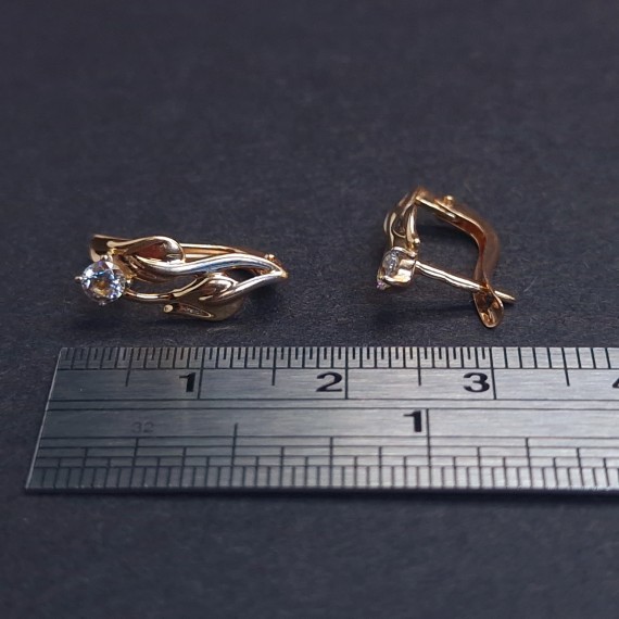 Gold earrings with zircons 