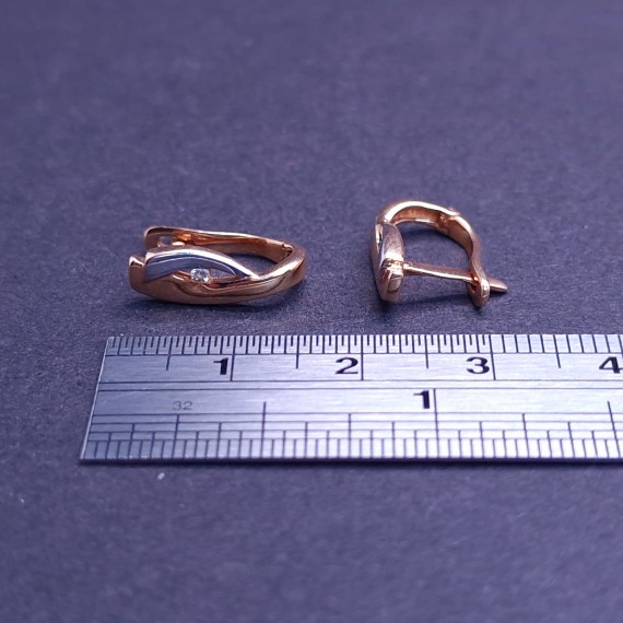 Gold earrings with zircons 