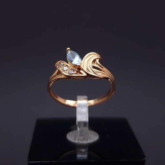 Gold ring with diamonds and colored stone