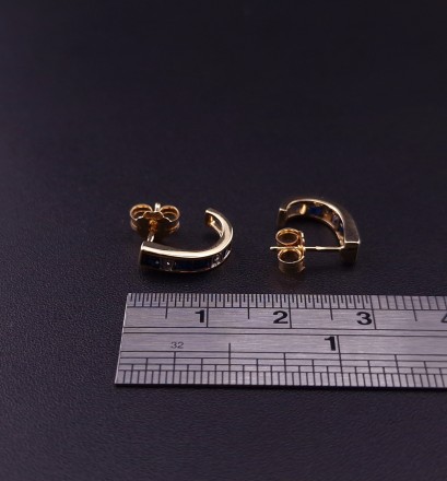 Gold earrings with diamonds and colored stones