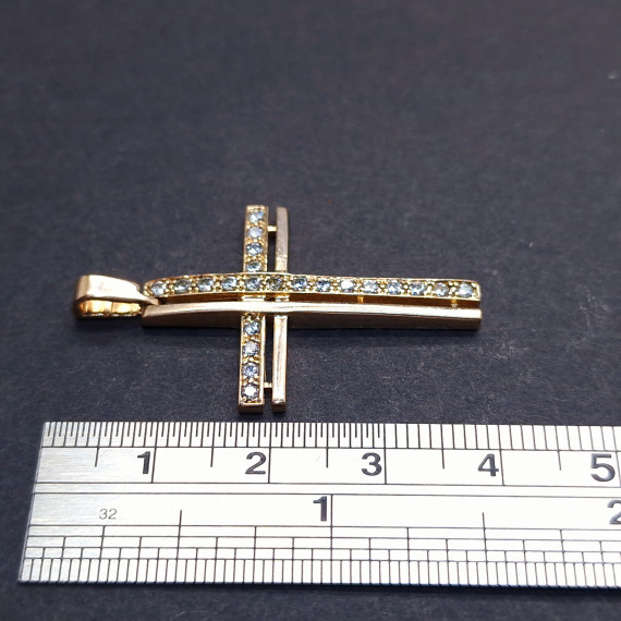 Gold cross with zircons