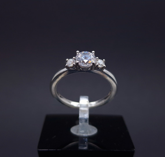 Silver ring with zircons