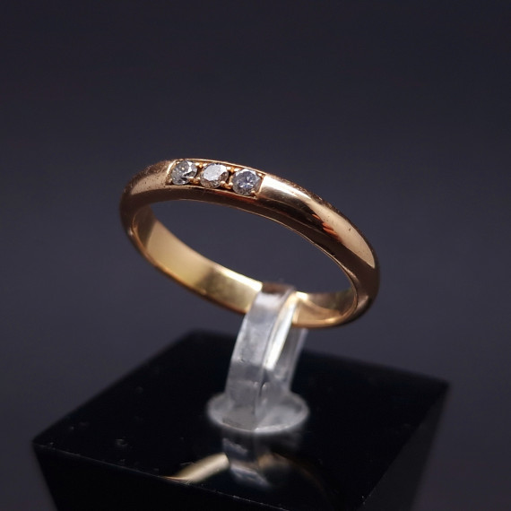 Gold wedding ring with diamonds