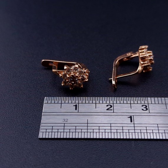 Gold earrings with zircons 