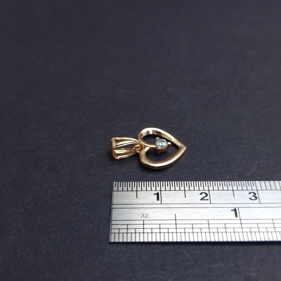 Gold pendant with zircon