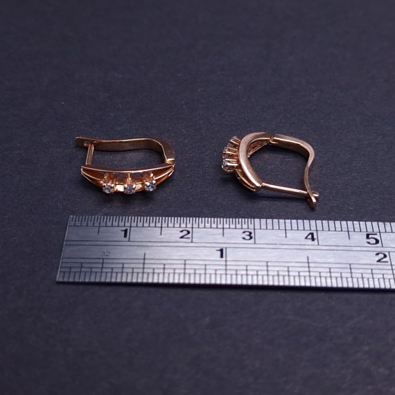 Gold earrings with zircons 