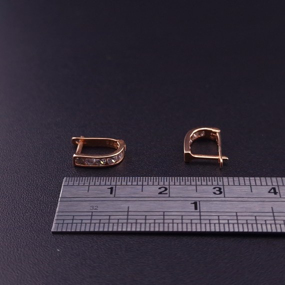 Gold earrings with zircons 