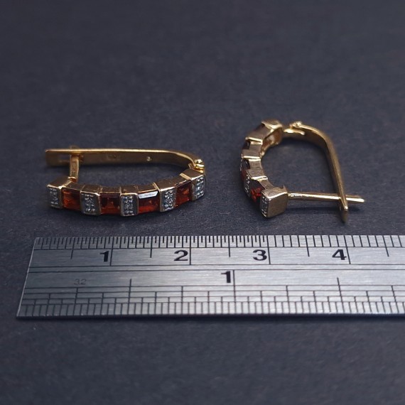 Gold earrings with diamonds and colored stones