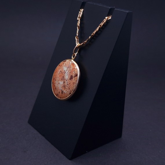 Vintage gold pendant with colored stone