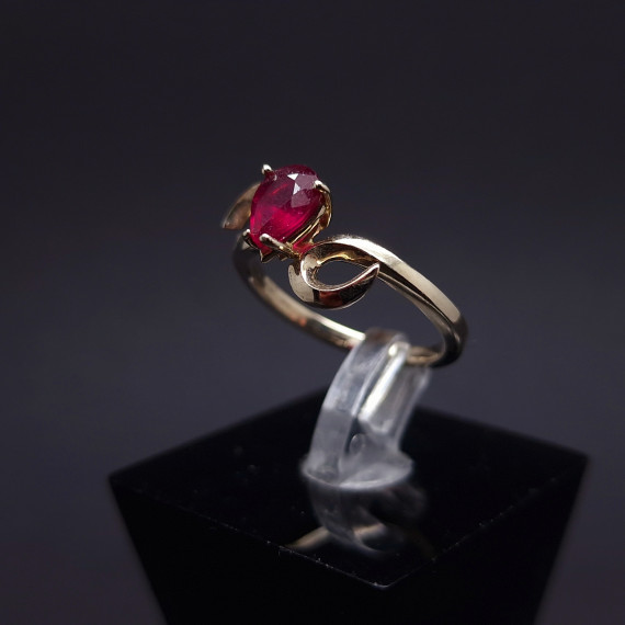 Gold ring with a garnet