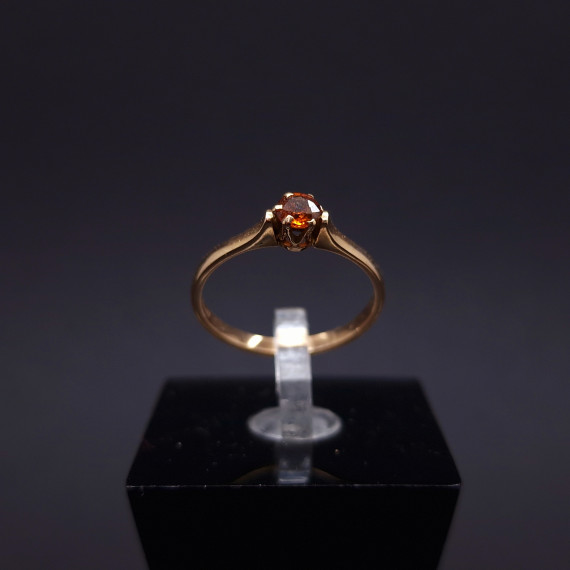 Gold ring with orange topaz