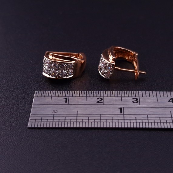 Gold earrings with zircons 