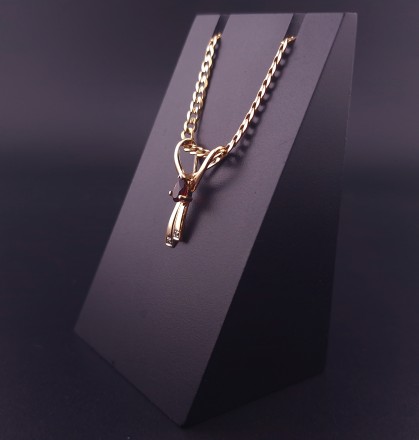 Gold pendant with colored stones