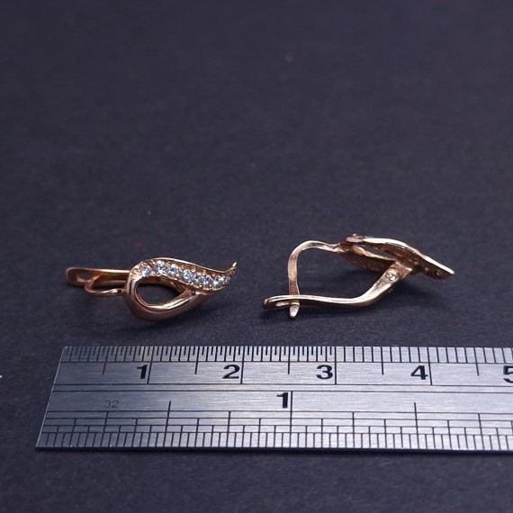 Gold earrings with zircons 