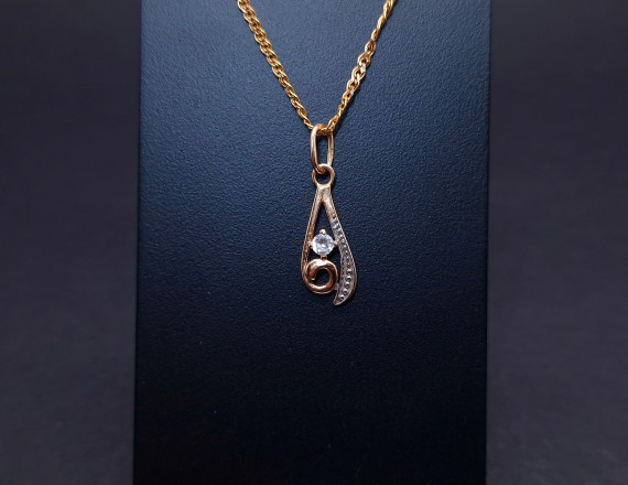 Gold pendant with zircon