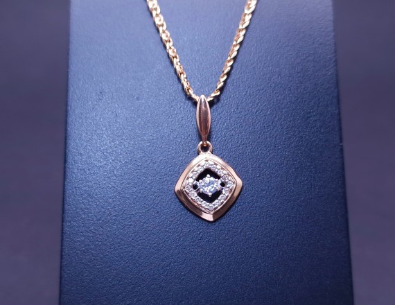 Gold pendant with zircons