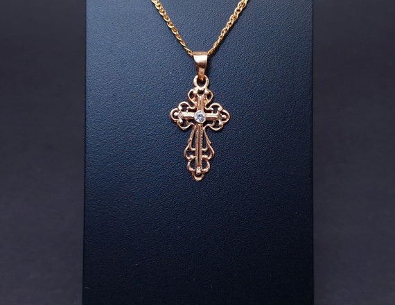 Gold cross with zircon