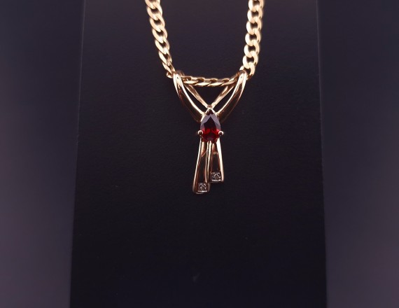 Gold pendant with colored stones